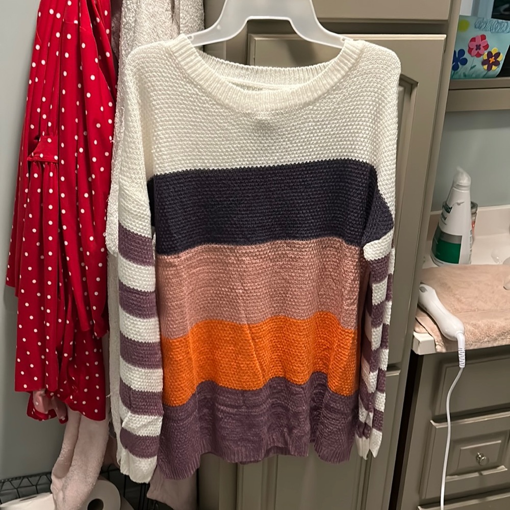 Women’s medium light boutique sweater with bell slit sleeves